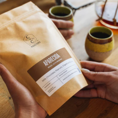 Someone holding one of Crosby Coffee's coffee beans